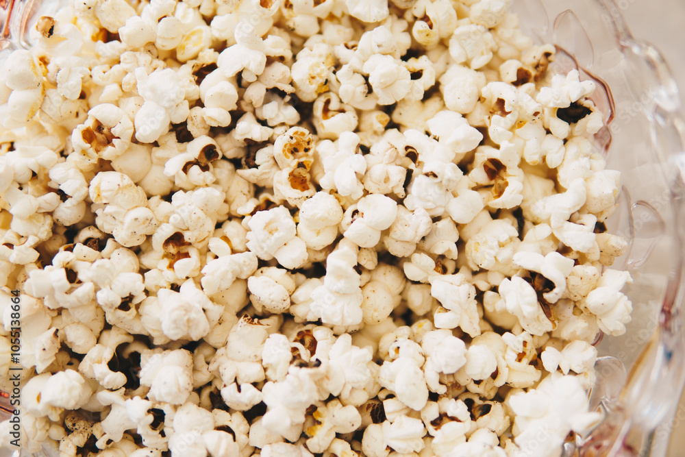 Detail of popcorn inside of a glass bowl Detail of popcorn inside of a glass bowl