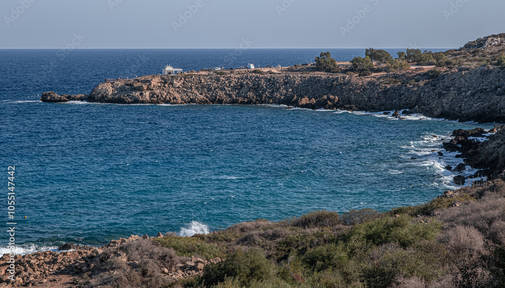 Fototapeta premium Konnos Bay Nature Trail, from Agioi Anargyroi Church to the Cyclops Cave and back, along the rugged coastline with beautiful sea and coast views, Cape Greco National Forest Park, Ayia Napa, Cyprus 