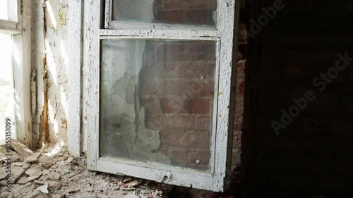 Haunting Interior of Abandoned Patarei Prison in Tallinn. Deteriorating Window Frame and Crumbling Walls of Former Soviet Prison photo