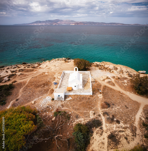 A stunning view of Naxos Island, Greece, featuring crystal-clear turquoise waters, rugged coastlines, and charming white-washed buildings. A picturesque paradise for travelers and sun-seekers.