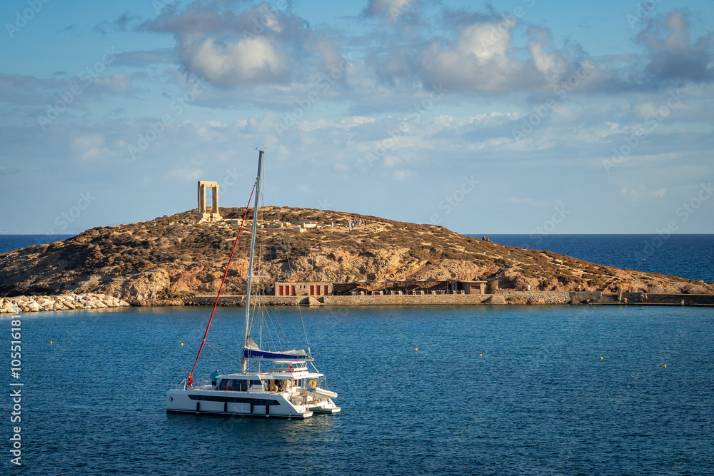 A stunning view of Naxos Island, Greece, featuring crystal-clear turquoise waters, rugged coastlines, and charming white-washed buildings. A picturesque paradise for travelers and sun-seekers.