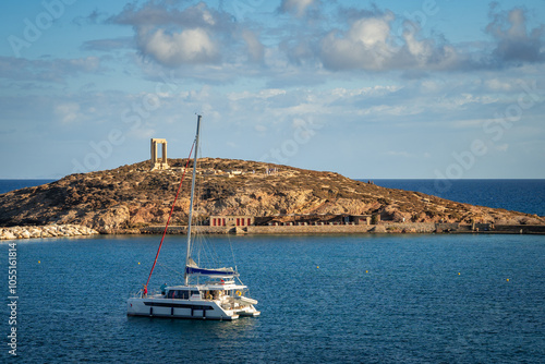 A stunning view of Naxos Island, Greece, featuring crystal-clear turquoise waters, rugged coastlines, and charming white-washed buildings. A picturesque paradise for travelers and sun-seekers.
