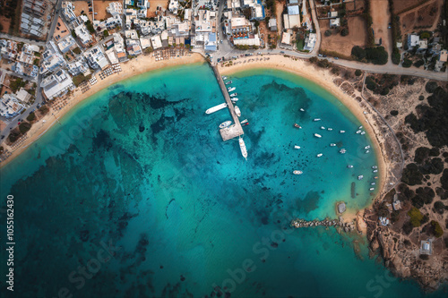 Obraz na płótnie A stunning view of Naxos Island, Greece, featuring crystal-clear turquoise waters, rugged coastlines, and charming white-washed buildings. A picturesque paradise for travelers and sun-seekers. w salonie