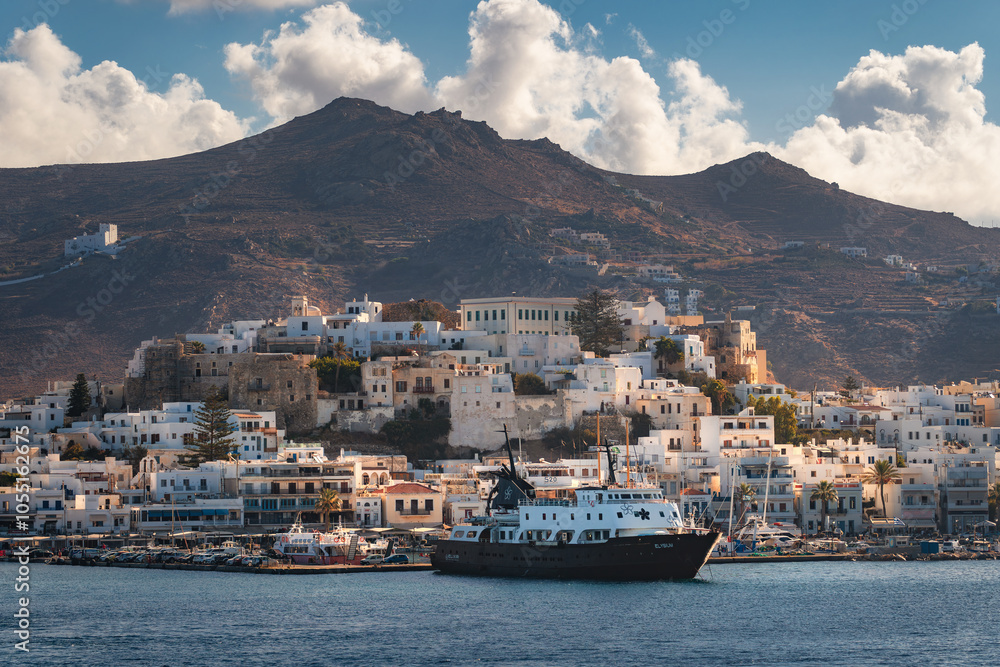 A stunning view of Naxos Island, Greece, featuring crystal-clear turquoise waters, rugged coastlines, and charming white-washed buildings. A picturesque paradise for travelers and sun-seekers.