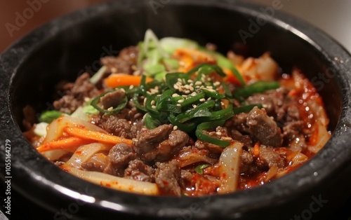 A bowl of savory stir-fried beef and vibrant mixed vegetables on a rustic wooden table.