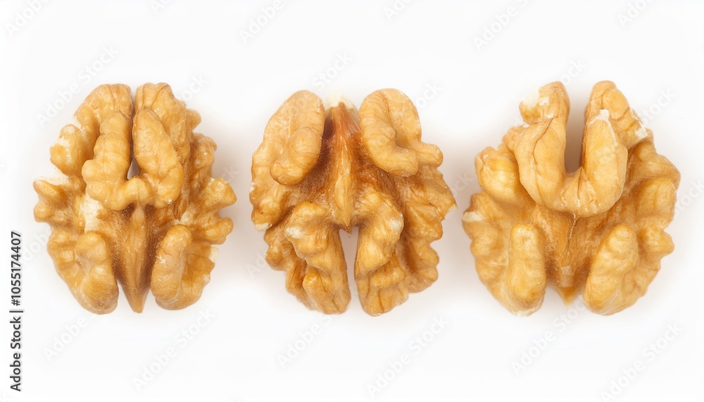 Peeled walnuts showing their brain like shape on white background
