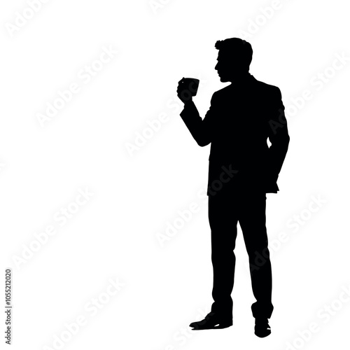 A businessman silhouette standing and drinking coffee, with one hand holding a coffee cup near his mouth