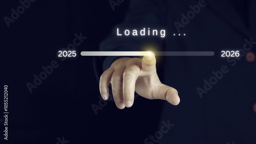 Businessman touching to downloading bar to change 2025 to 2026 year for change and preparation new business year concept.