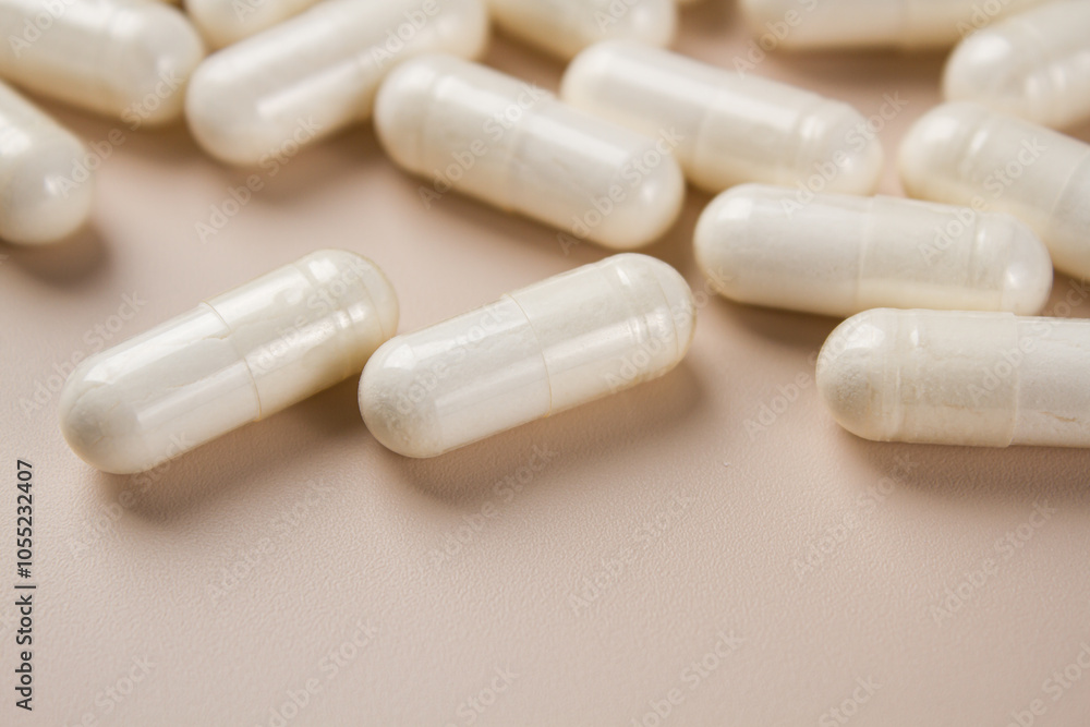 Vitamin capsules on a light background. Dietary supplements for health Vitamin capsules on a light background. Dietary supplements for health