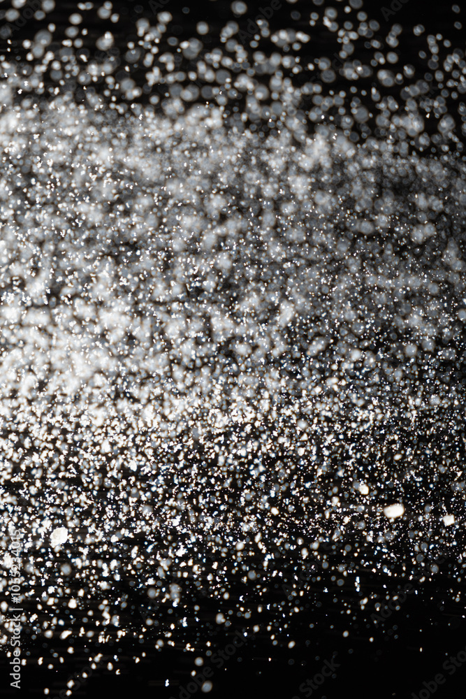 Abstract black and white background of pouring flour, space for text Abstract black and white background of pouring flour, space for text