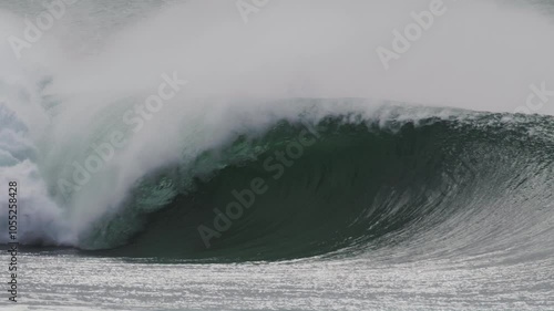 Stormy day in Sydney with slow motion waves crashing along the coast, turbulent seas and huge swells