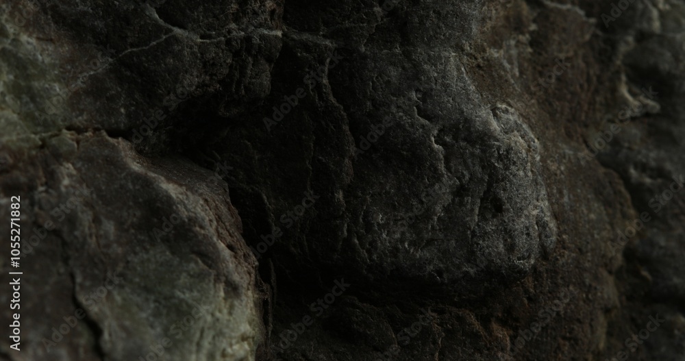 Close-Up of Textured Dark Rock Surface with Natural Crevices Close-Up of Textured Dark Rock Surface with Natural Crevices