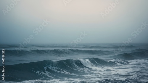 A stunning close-up of a powerful ocean wave, captured in rich shades of blue. The dynamic motion of the water showcases nature's beauty and strength