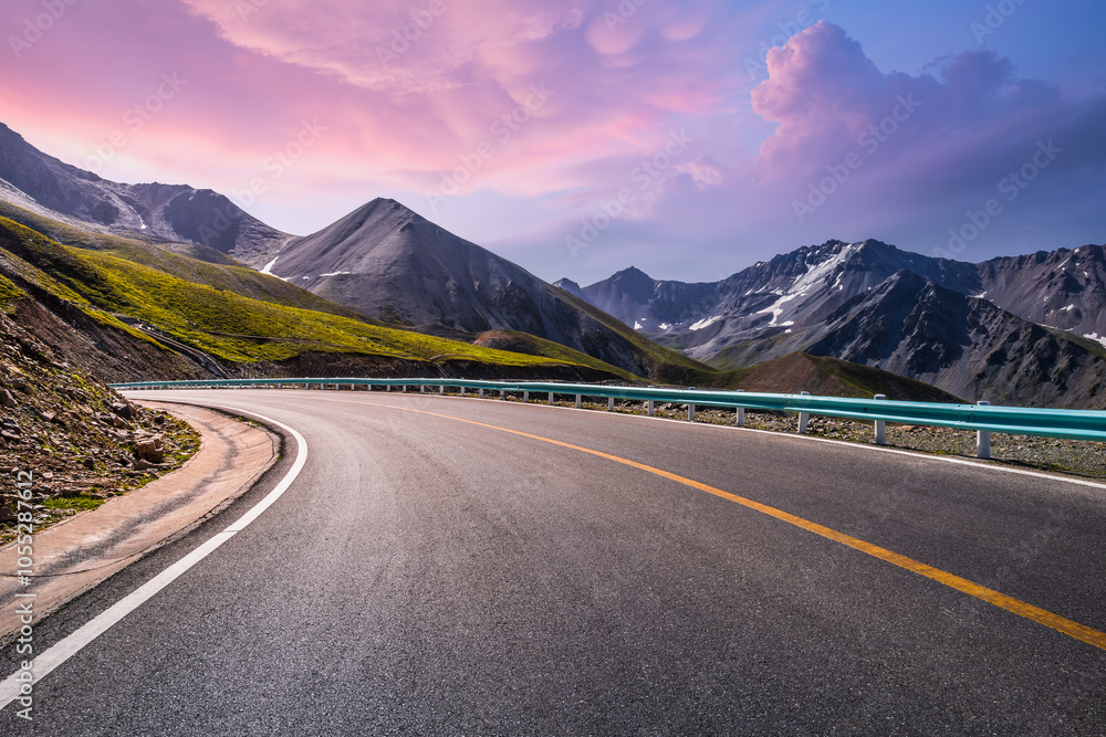 Asphalt highway road and mountain nature landscape at sunset. Road trip. Asphalt highway road and mountain nature landscape at sunset. Road trip.