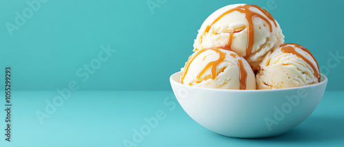 Obraz na płótnie Delicious bowls of ice cream drizzled with caramel, bright turquoise backdrop, perfect for sweet cravings or dessert-related themes. w salonie