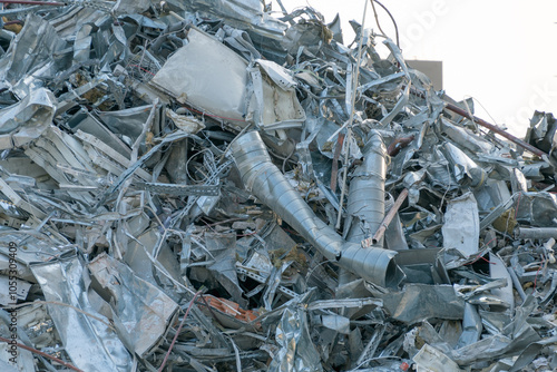 The wreckage of a demolished building. A pile of construction waste on a construction site. Concrete, metal.