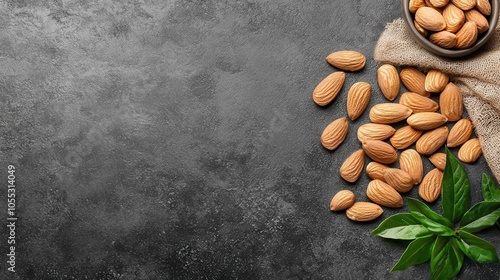 Raw almonds scattered on rustic background, vegan ingredients, natural snack concept photo