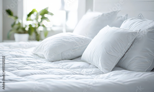 close up shot of white bed with fluffy pillows and quilted mattress, inviting and relaxing
