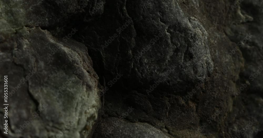 Close-up of Dark Basalt Rock Surface with Natural Texture Close-up of Dark Basalt Rock Surface with Natural Texture