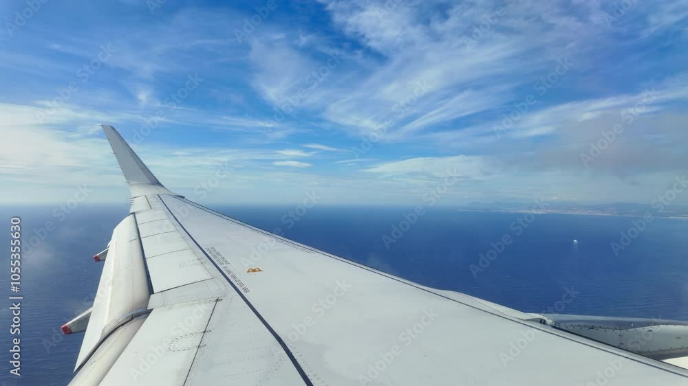 Sea view from an airplane window of the aircraft wing Sea view from an airplane window of the aircraft wing