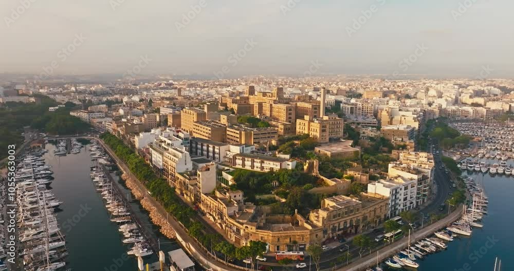 Aerial View of Urban Landscape in Valletta Malta Featuring Historic Streets and Buildings with Boats and Yachts in the Marina at This European Tourist Destination. High quality 4k footage Aerial View of Urban Landscape in Valletta Malta Featuring Historic Streets and Buildings with Boats and Yachts in the Marina at This European Tourist Destination. High quality 4k footage