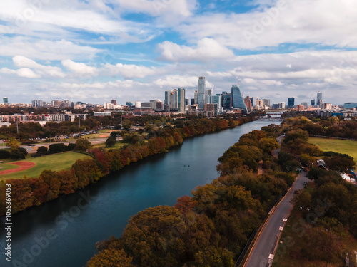 Aerial view of beautiful Zilker Park with river, trees, and skyline, Austin, United States.