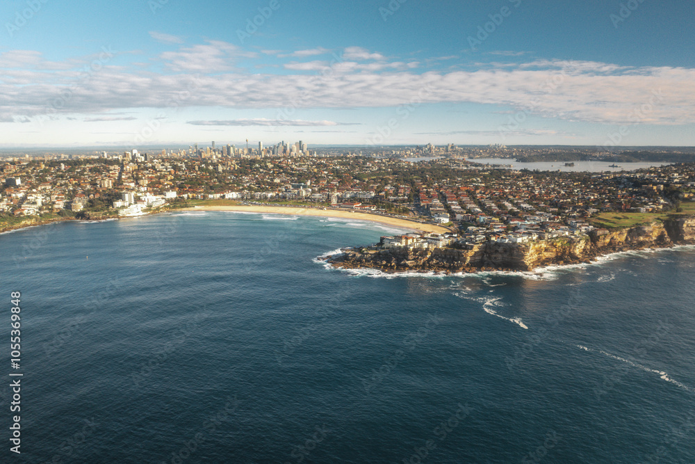 Aerial view of bondi beach with ocean waves and coastal cliffs, North Bondi, Australia. Aerial view of bondi beach with ocean waves and coastal cliffs, North Bondi, Australia.