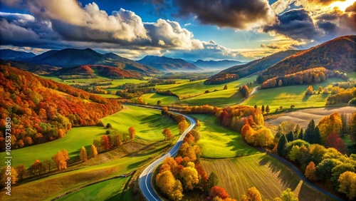 Aerial View of Scenic Road in Vibrant Nature Landscape with Mountains and Hills Under Blue Sky, Showcasing Autumn