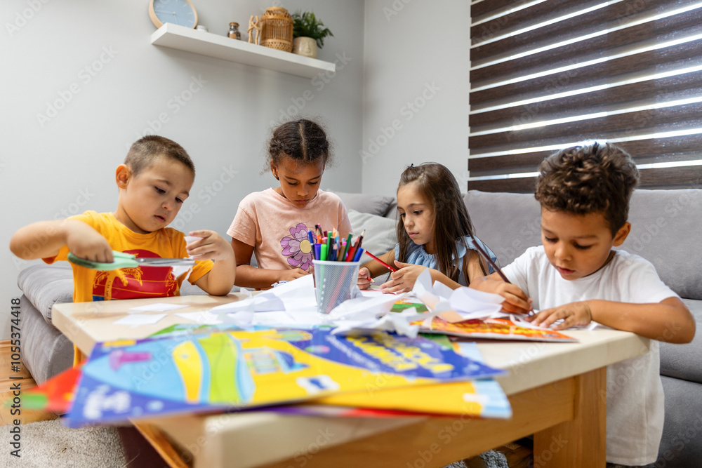 Children crafting colorful art together at a table Children crafting colorful art together at a table