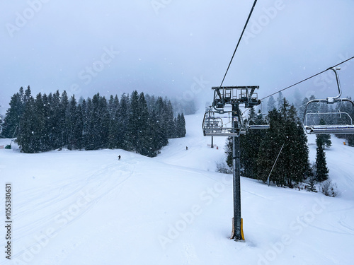 Ski Lift snowy mountain winter forest with chair lift At The Ski Resort in winter. Snowy weather Ski holidays Winter sport and outdoor activities Outdoor tourism photo