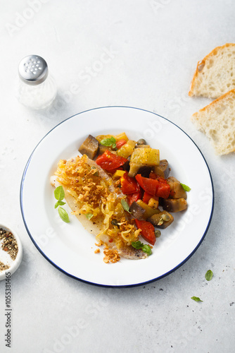 White fish fillet with onion crunch and vegetables