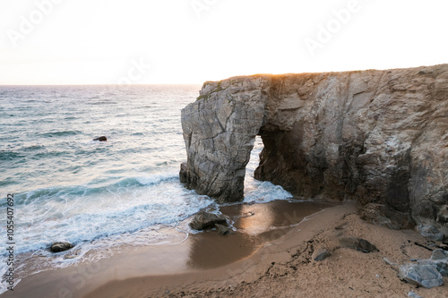 Aerial view of the beautiful natural arch at Port-Blanc with sandy beach and waves, Saint-Pierre-Quiberon, France. photo