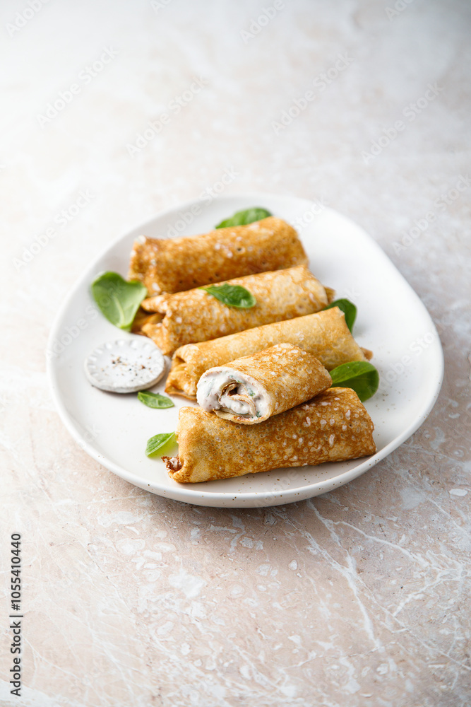 Crepes with creamy filling and raisins Crepes with creamy filling and raisins
