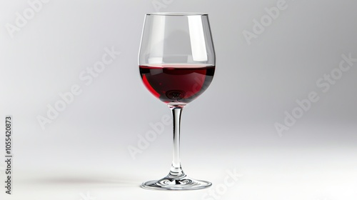 A single glass of red wine, half full, with a white background.