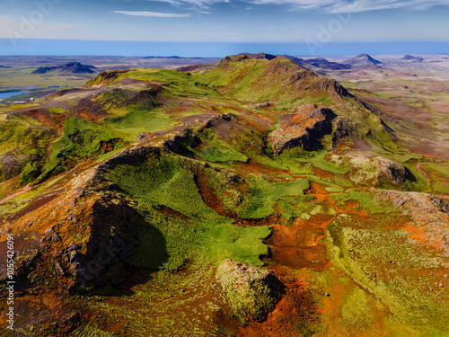 Aerial view of beautiful volcanic landscape with mountains and valleys at sunset, Grindavik, Iceland.