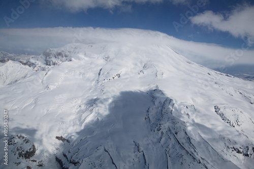 Aerial view of snowy mount elbrus in the beautiful caucasus mountains, kabardino balkar republic, russia. photo