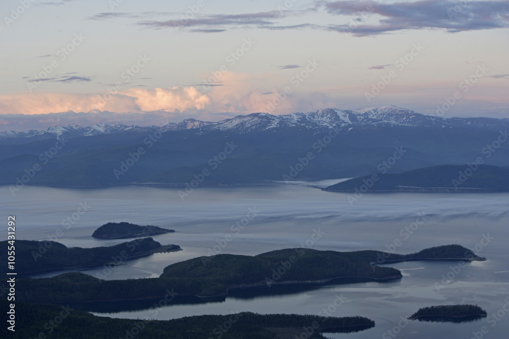 Aerial view of serene Baikal Lake with tranquil waters and majestic mountains, Irkutsk Oblast, Russia. Aerial view of serene Baikal Lake with tranquil waters and majestic mountains, Irkutsk Oblast, Russia.