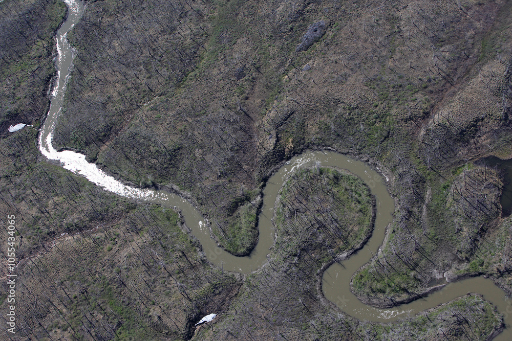 Aerial view of meandering river through rugged and untouched wilderness, Taymyr Autonomous Okrug, Russia. Aerial view of meandering river through rugged and untouched wilderness, Taymyr Autonomous Okrug, Russia.