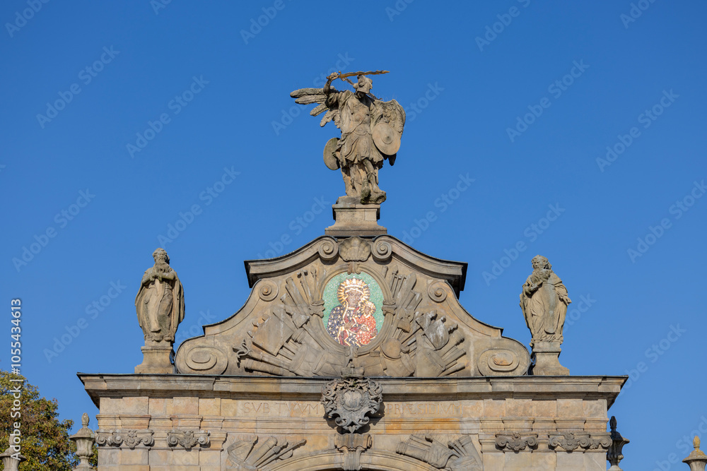 Czestochowa, Poland - October 18, 2024: 14th century baroque Jasna Gora Monastery, famous pilgrimage center. Lubomirski Gate with mosaic of Our Lady Queen and sculpture of St. Michael the Archangel