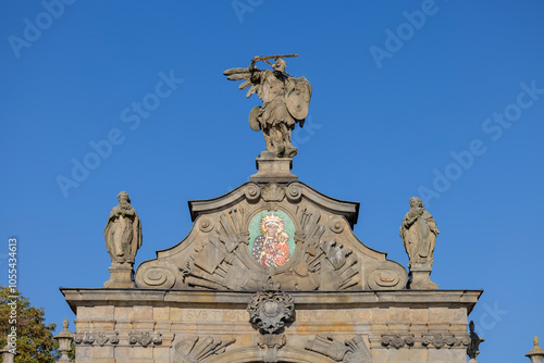 Obraz na płótnie Czestochowa, Poland - October 18, 2024: 14th century baroque Jasna Gora Monastery, famous pilgrimage center. Lubomirski Gate with mosaic of Our Lady Queen and sculpture of St. Michael the Archangel w salonie