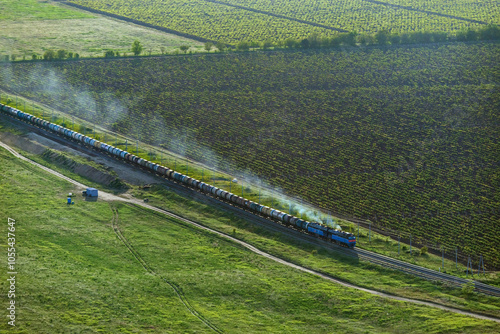 Aerial view of a tranquil countryside landscape with fields and a railway, Krasnodar region, Russia.