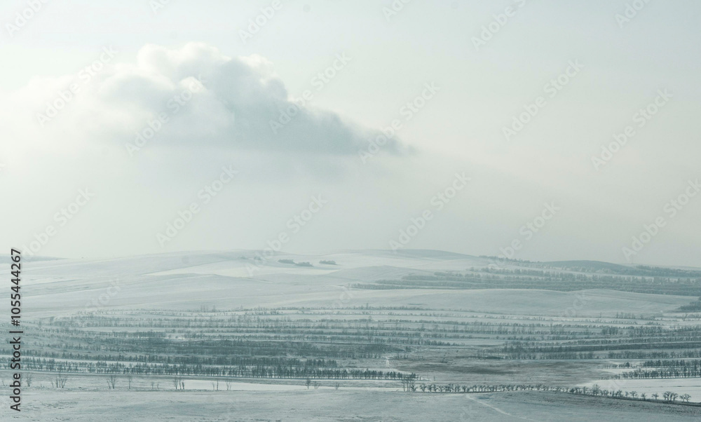Aerial view of vast snowy steppe under a serene sky with clouds, Khakassia Republic, Russia. Aerial view of vast snowy steppe under a serene sky with clouds, Khakassia Republic, Russia.