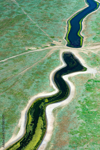 Aerial view of a beautiful farm in the steppe with meandering rivers and unusual patterns, Kalmykia Republic, Russia. photo