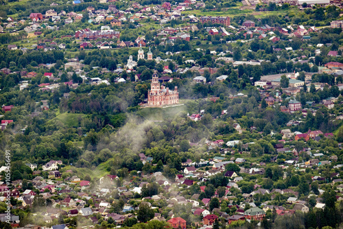 Aerial view of picturesque Moscow cityscape with historic church and suburban greenery, Moscow, Russia.