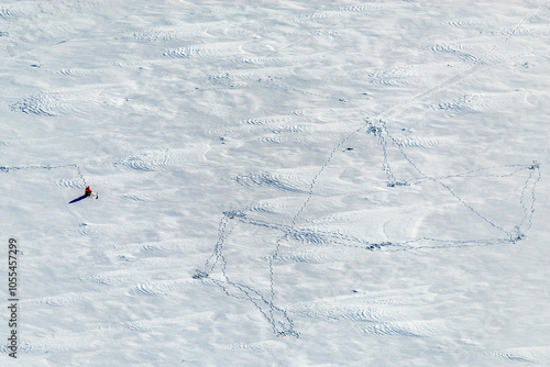Aerial view of frozen Lake Ladoga surrounded by serene winter landscape, Karelia Republic, Russia.