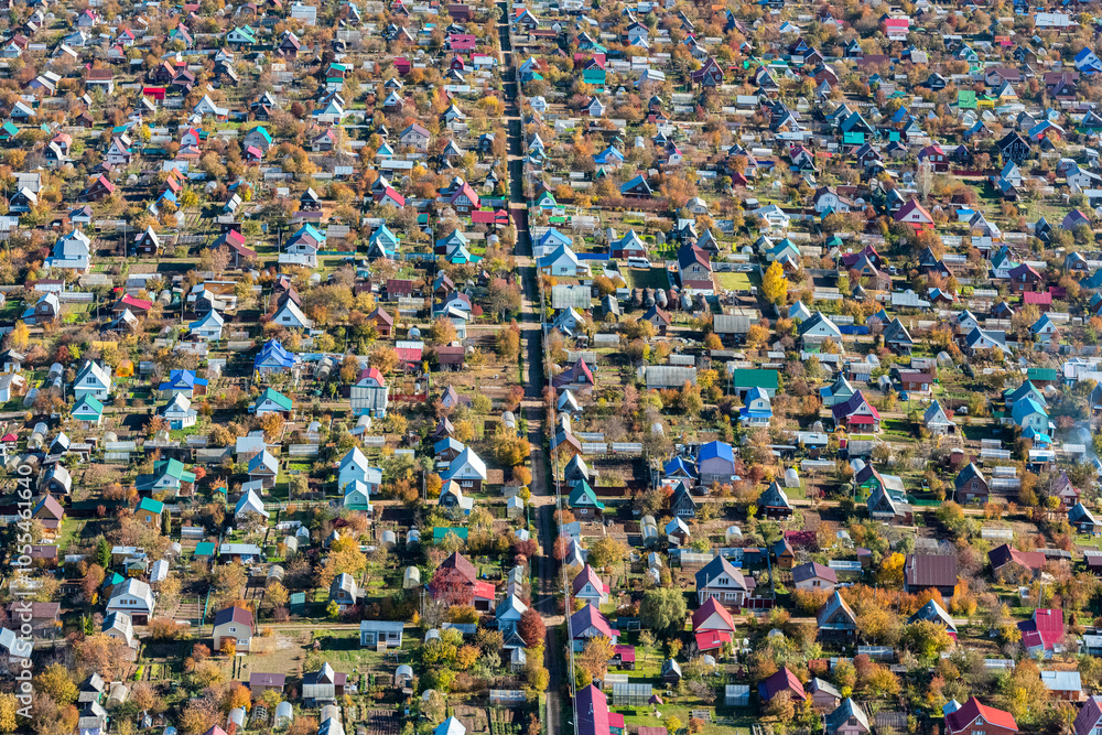 Aerial view of colorful homes and trees in a residential village, Yagul, Russia. Aerial view of colorful homes and trees in a residential village, Yagul, Russia.