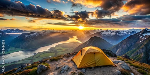 A solitary yellow tent perched atop a mountain peak, overlooking a breathtaking panorama of snow-capped peaks, a meandering river, and a vibrant sunset casting long shadows across the landscape. photo