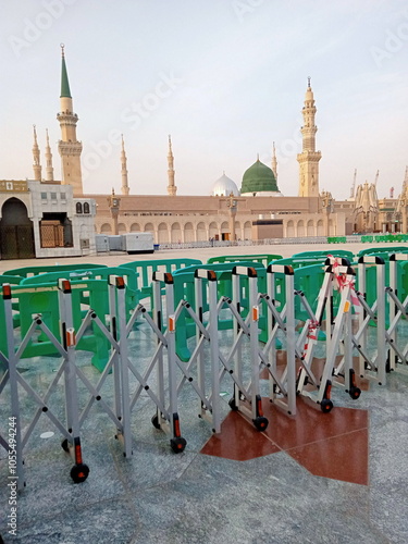 The Prophet's Mosque or Nabawi Mosque seen from the outside or courtyard of the mosque during the daytime photo