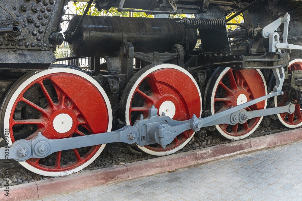 Mechanical wheels of a transport steam locomotive on rails Mechanical wheels of a transport steam locomotive on rails