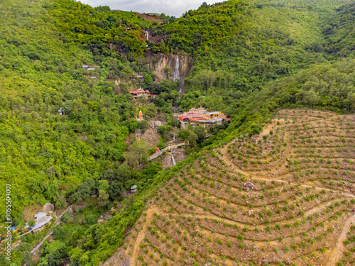 The Buddhist temple in the rock.

Suoi Do Pogoda. There is a waterfall in the rock near the pagoda. Not far from Nha Trang. Cloudy weather. Shooting from a drone. photo